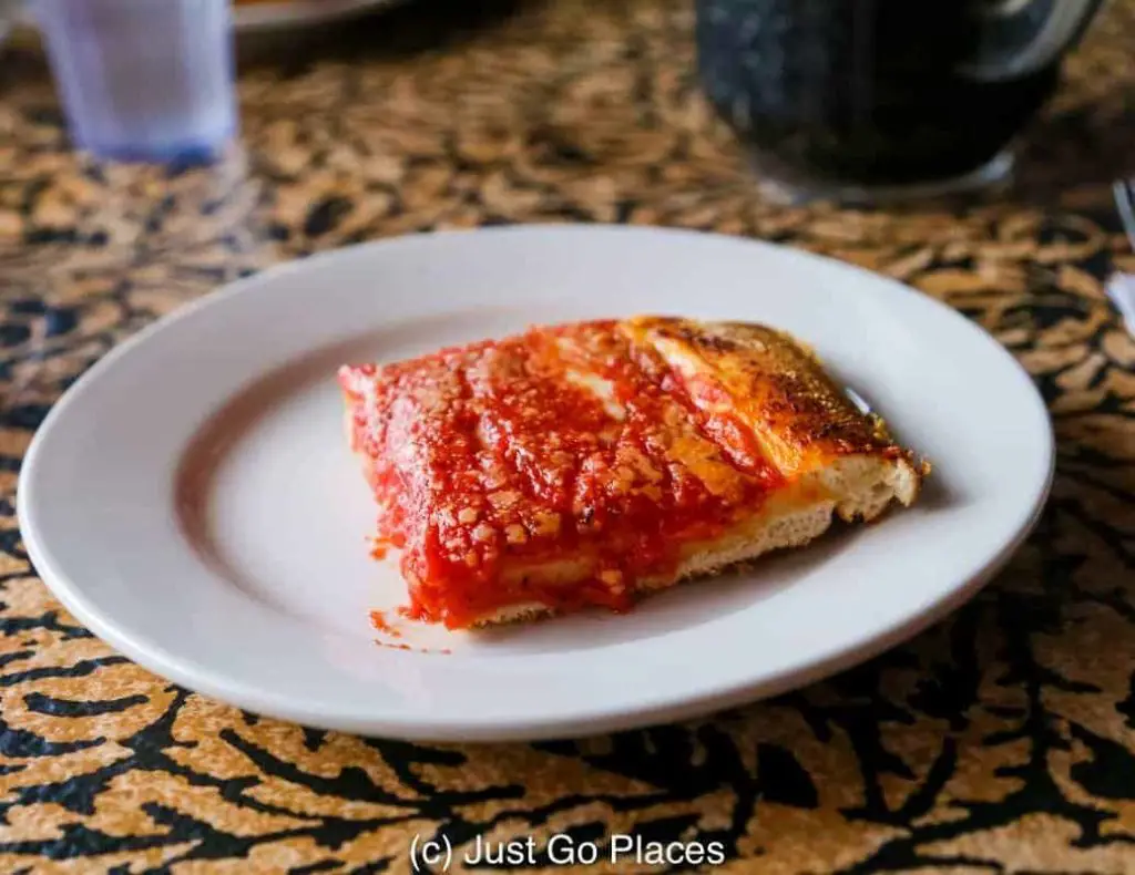 A slice of Sicilian pizza from L&B Spumoni Gardens in Brooklyn