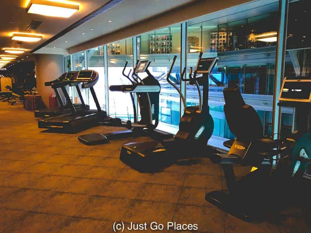 The small hotel gym overlooks the mall. 
