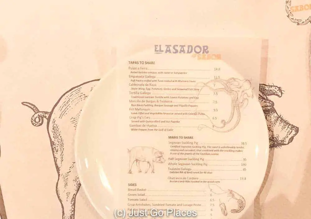 The Sabor restaurant menu is printed on either a drawing of either a pig or an octopus 