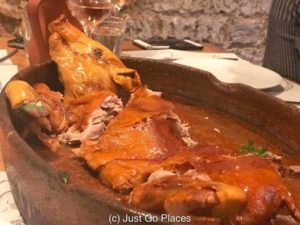 1/2 of a Segovian suckling pig which really is sliced in half