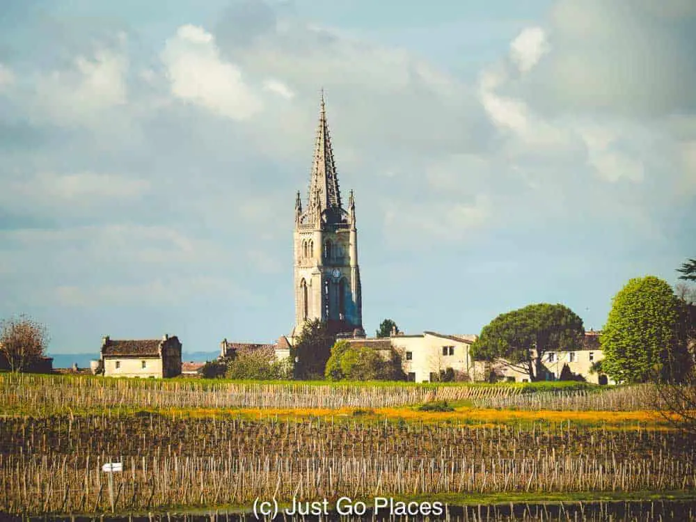 The spire of the St Emilion monolithic church  can be seen from the fields of the Vineyards in St Emilion nearby.