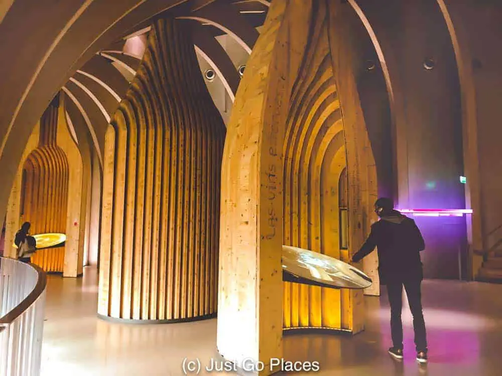 Interactive exhibits in artfully shaped wine bottle stands at the wine museum Bordeaux France 