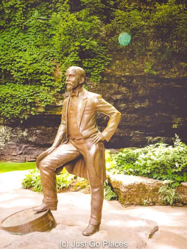 A statue of Mr. Jack stands in front of the limestone spring water