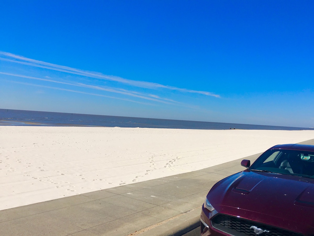 sea and sand of Coastal Mississippi on a cloudless day