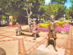 A statue to the four girls killed in the 16th Street Baptist Church Birmingham bombing at the corner of Kelly Ingram Park facing onto the church itself.
