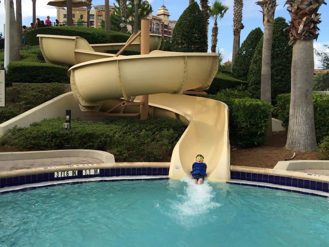 child on waterside at the Hilton Orlando Bonnet Creek pool