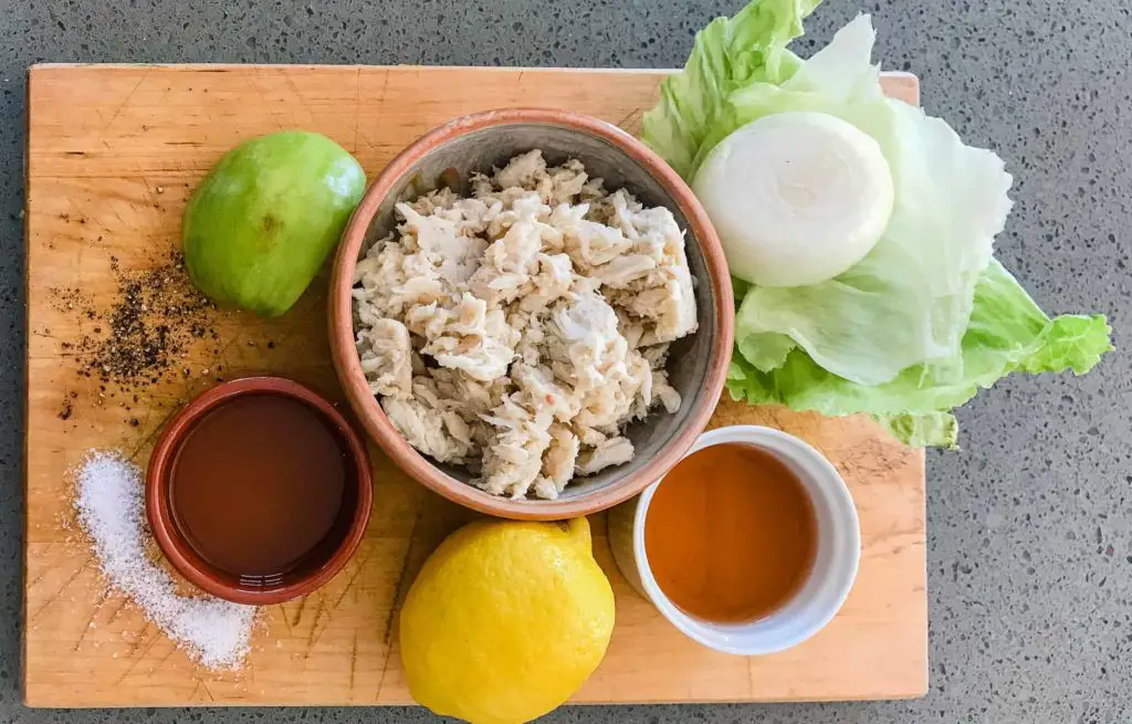 ingredients for West Indies Salad includes salt,peper, vinegar, oil, lemon, crabmeat, onion apple and lettuce