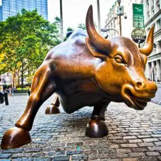 The landmark Charging Bull in Lower Manhattan represents aggressive financial optimism and prosperity