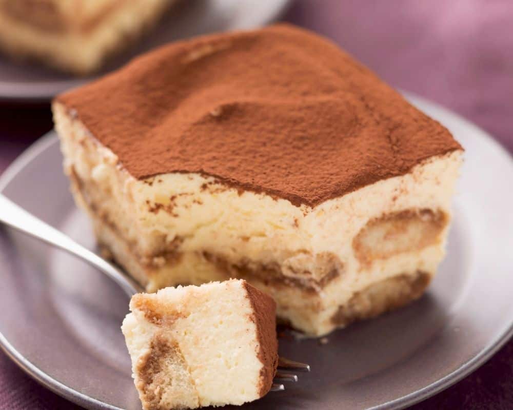 Tiramisu with a piece on a fork