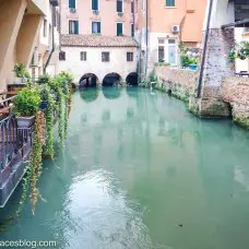 Things to do in Treviso include sitting in a Treviso restaurant on a canal