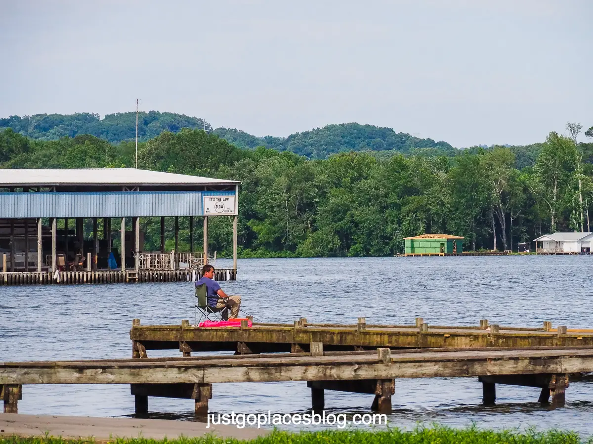 man fishing on a pier at Lake Guntersville in Scottsboro Alabama
