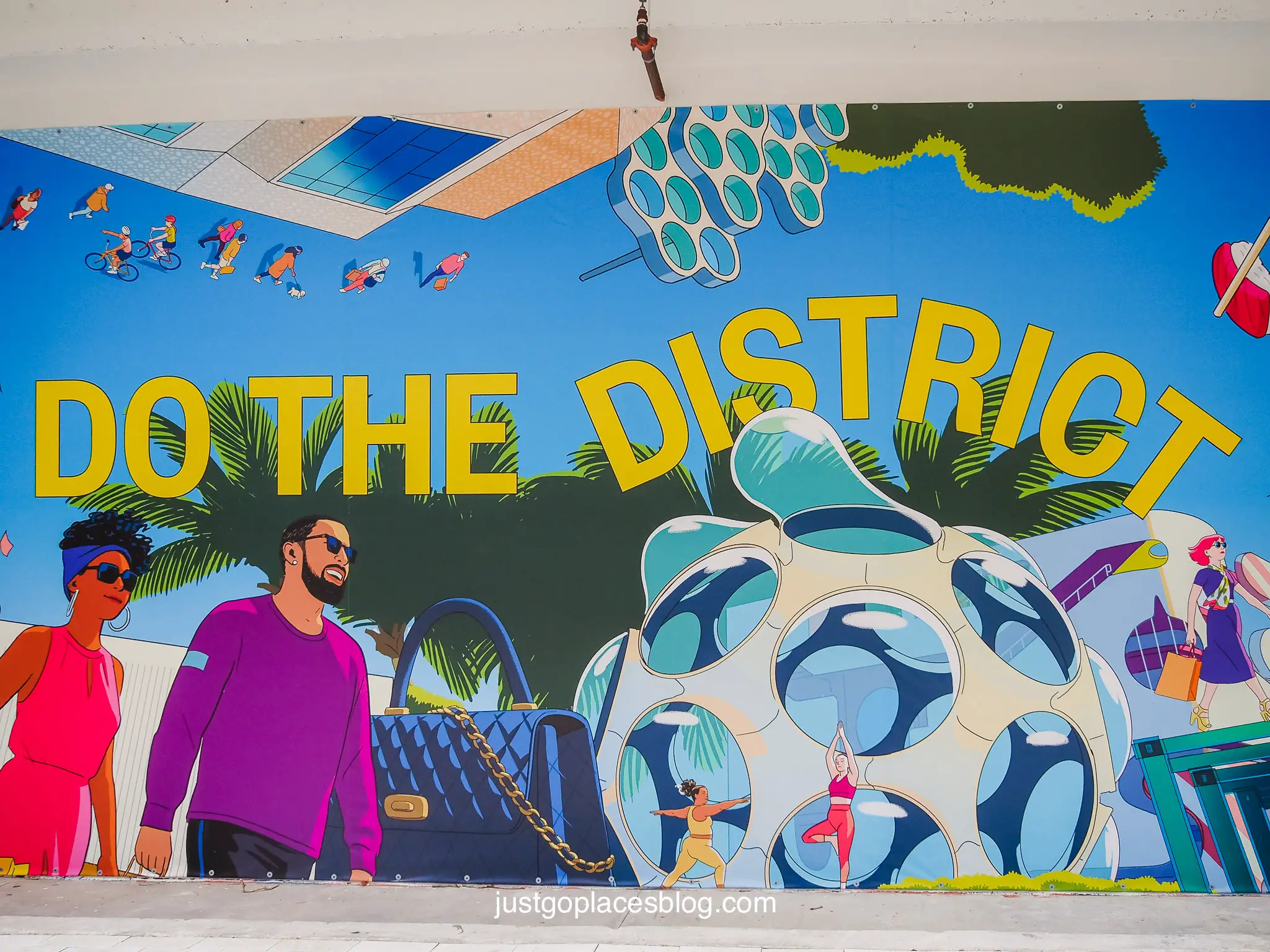 A street mural that says "do the district" in the Miami Arts District