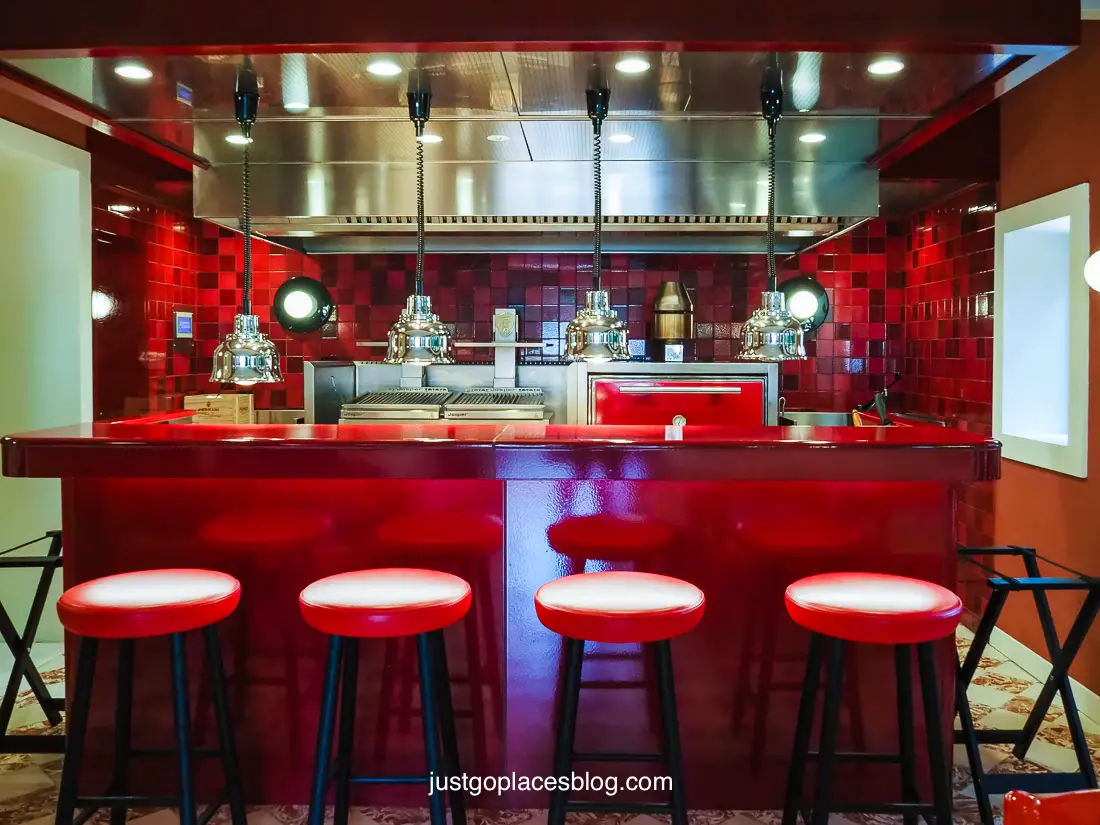 The sleek bar at the Cavallino Restaurant in the trademark Ferrari red.